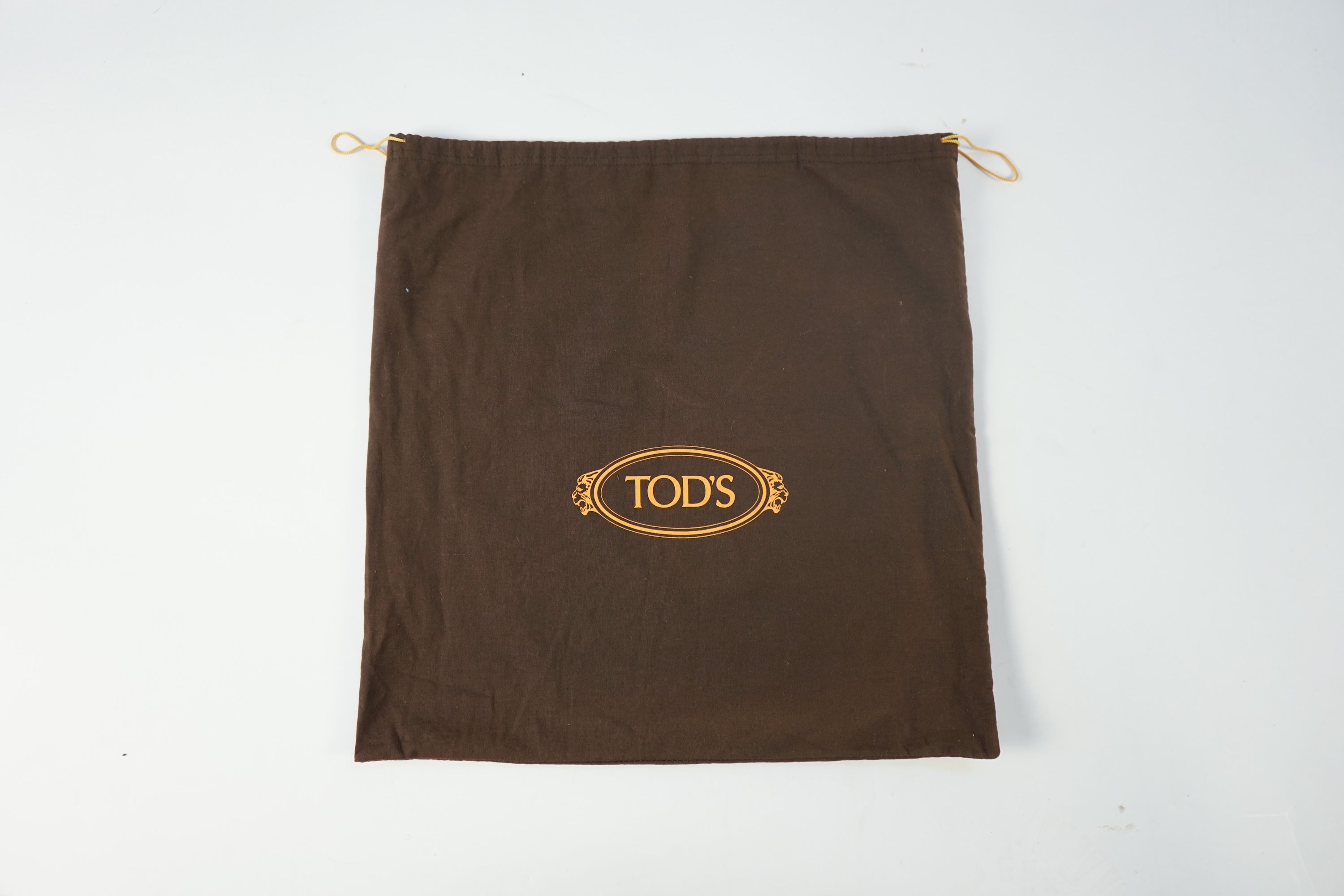 A brown leather Tod's shoulder bag with dust bag